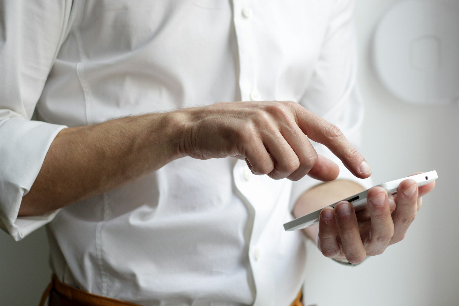 Business owner holding a smartphone